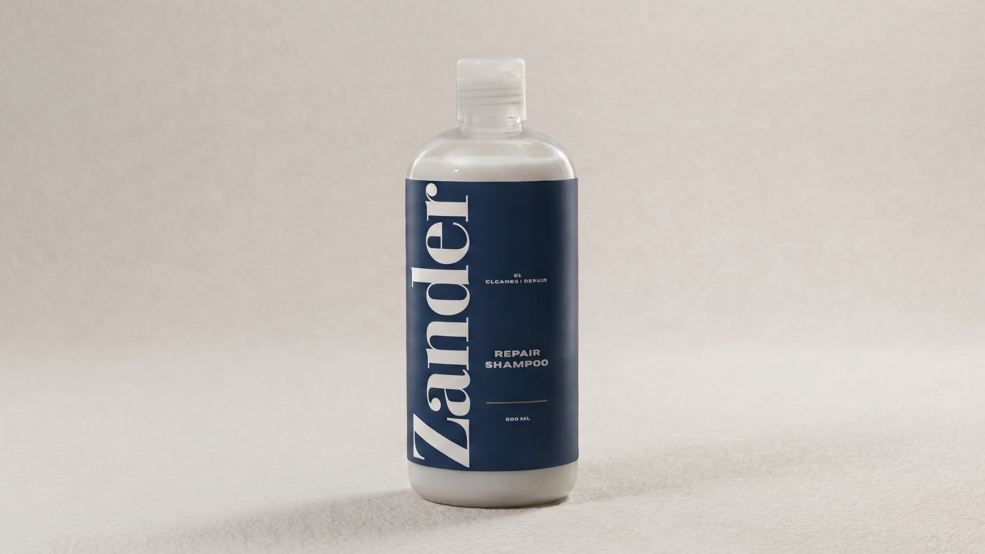 Matte deep blue Zander Moisture Cleanse shampoo bottle with champagne gold pump on a limestone ledge