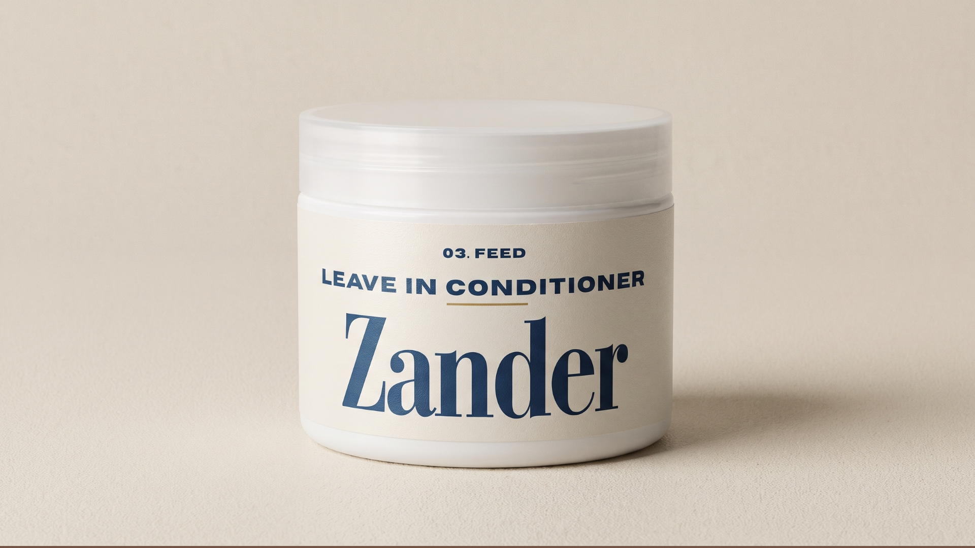 Warm ivory Zander Melt + Seal hair butter jar with champagne gold lid on a limestone ledge