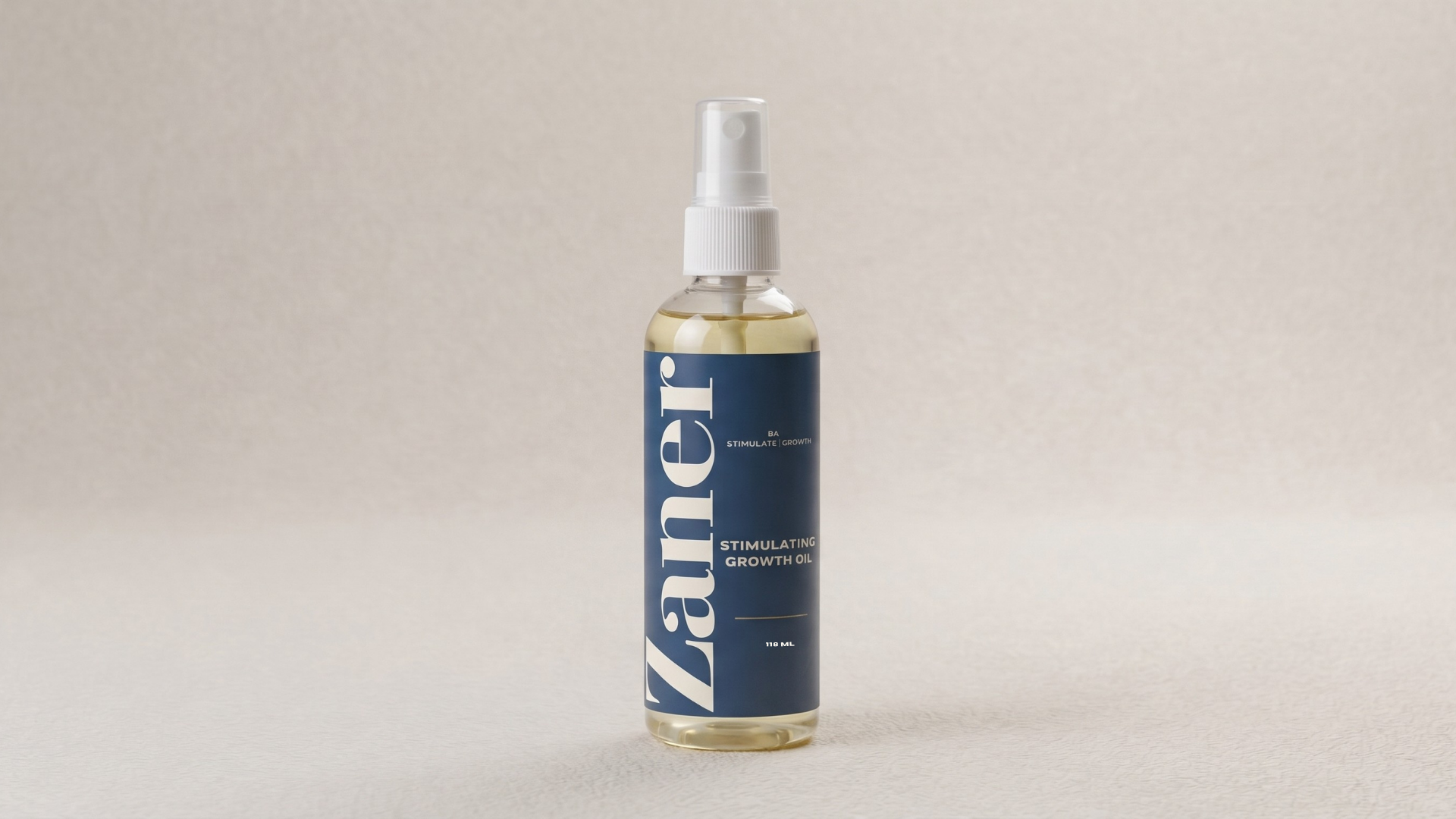 Amber glass Zander Root Revival growth serum dropper bottle with champagne gold collar on limestone
